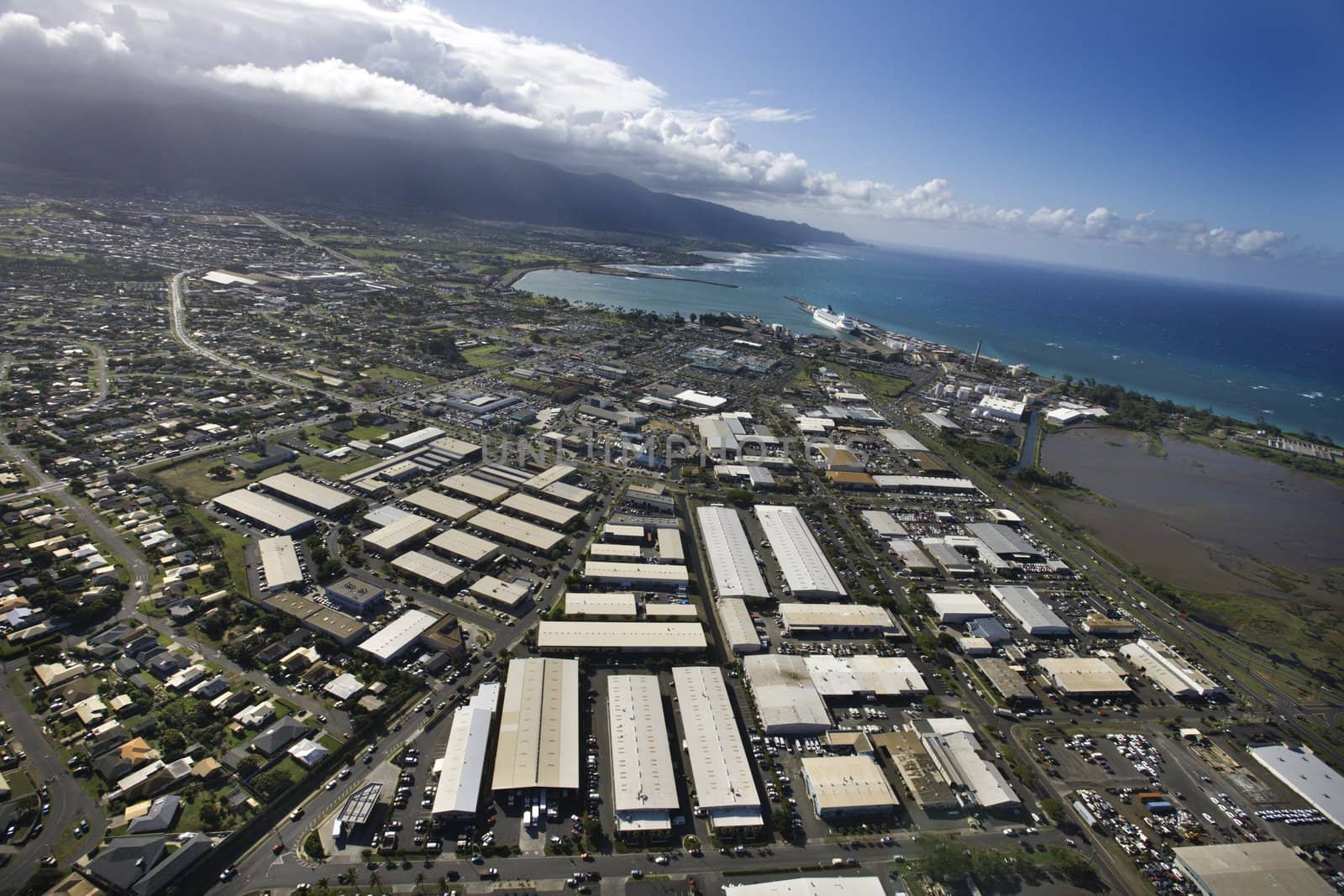 Aerial of Maui coastline with buildings and roads.