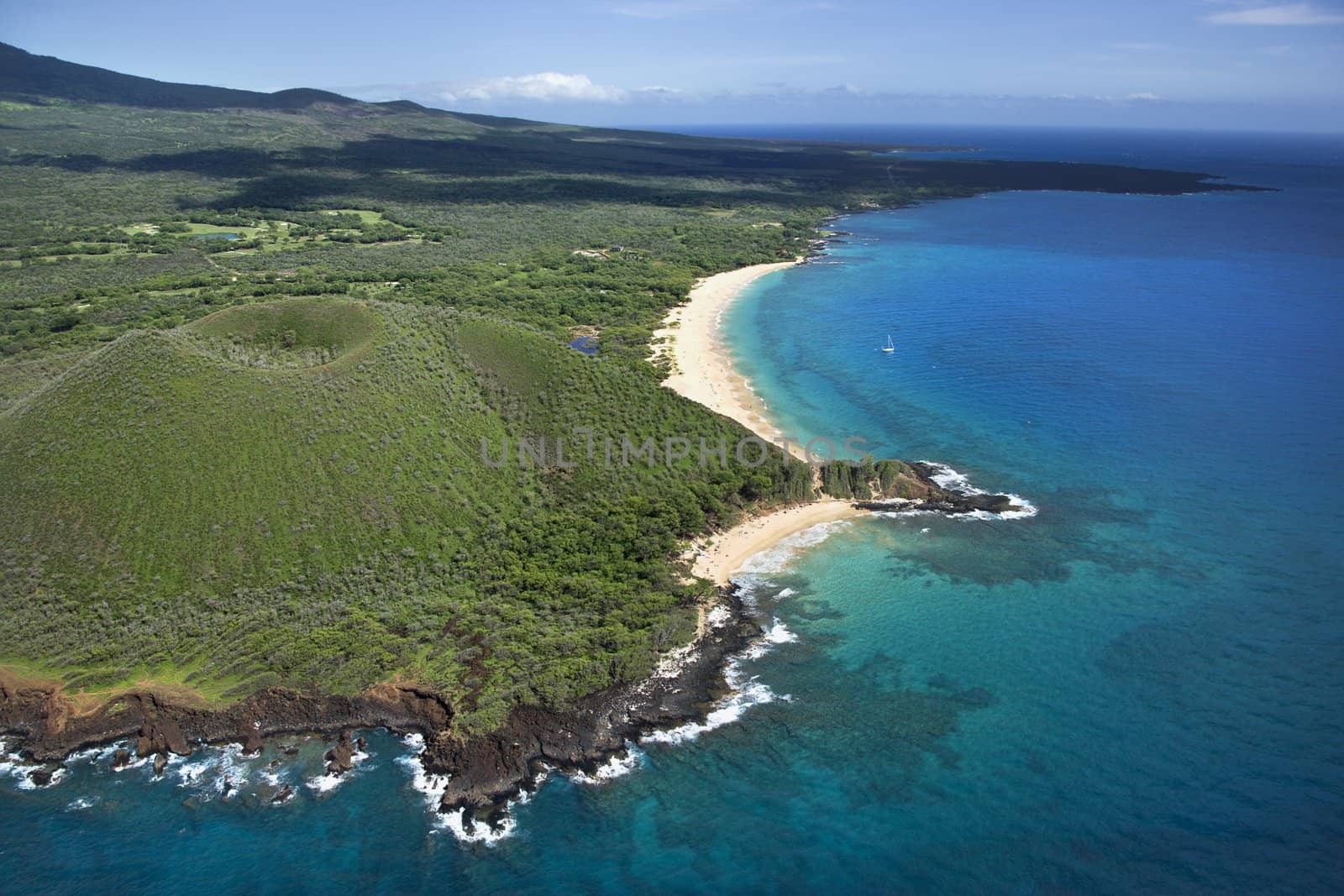 Aerial view of crater on Maui, Hawaii coast with beach.