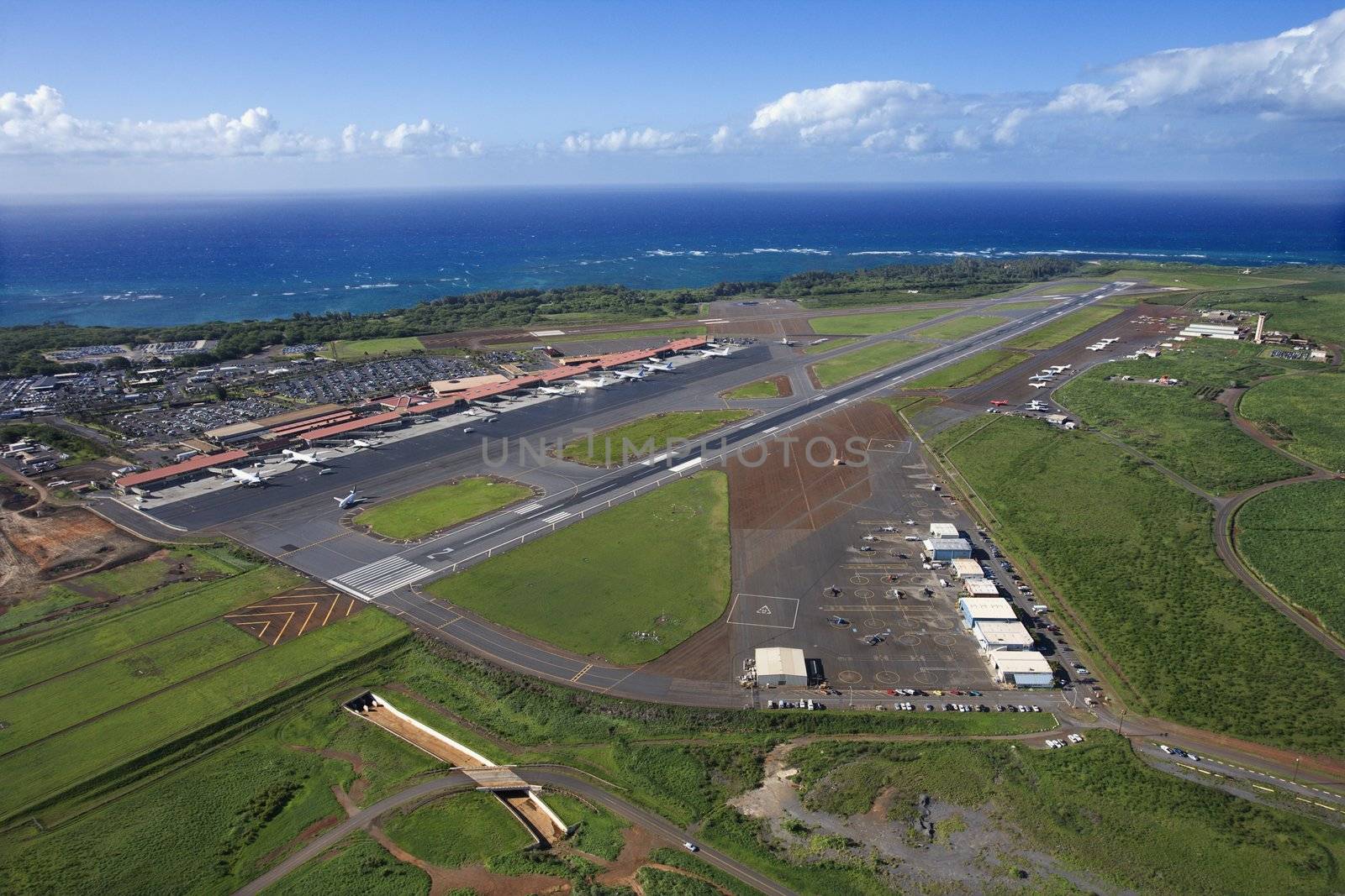 Aerial view of Maui, Hawaii airport with Pacific ocean.