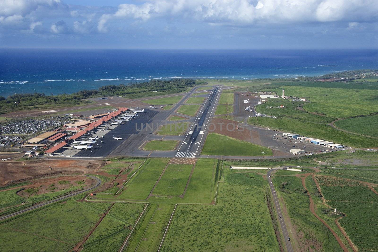 Aerial view of Maui, Hawaii airport with Pacific ocean.