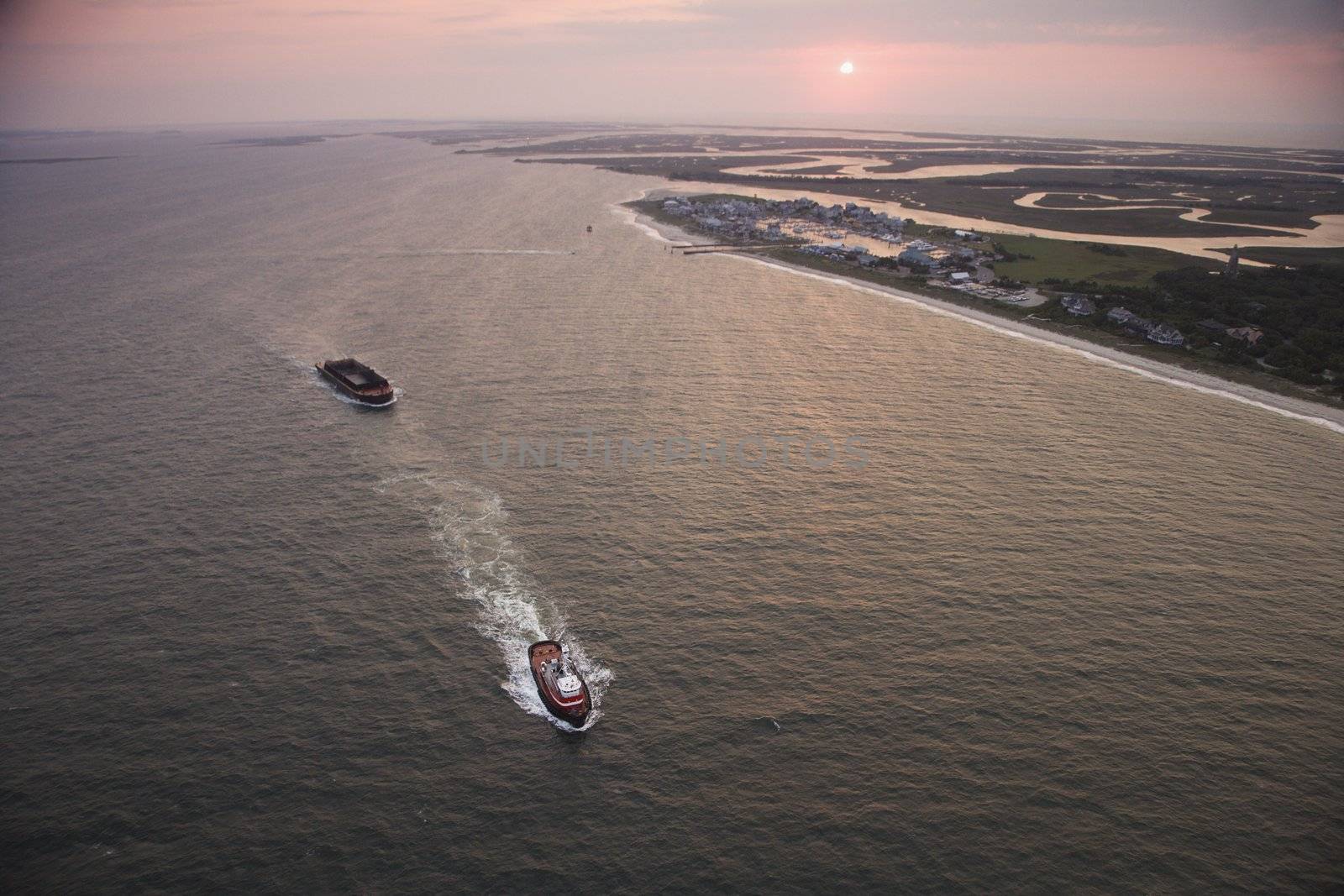 Aerial view of Bald Head Island North Carolina coastline during sunrise.