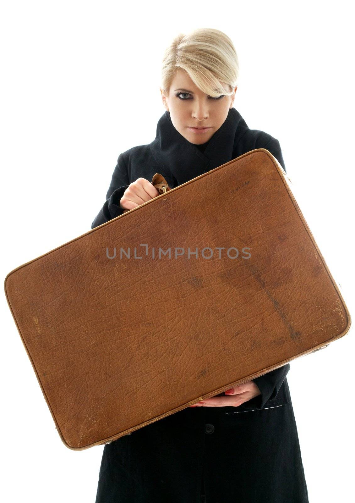 aggressive blond showing big brown suitcase over white background