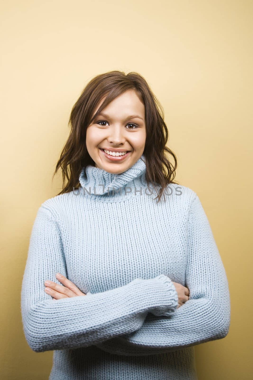 Woman wearing sweater. by iofoto