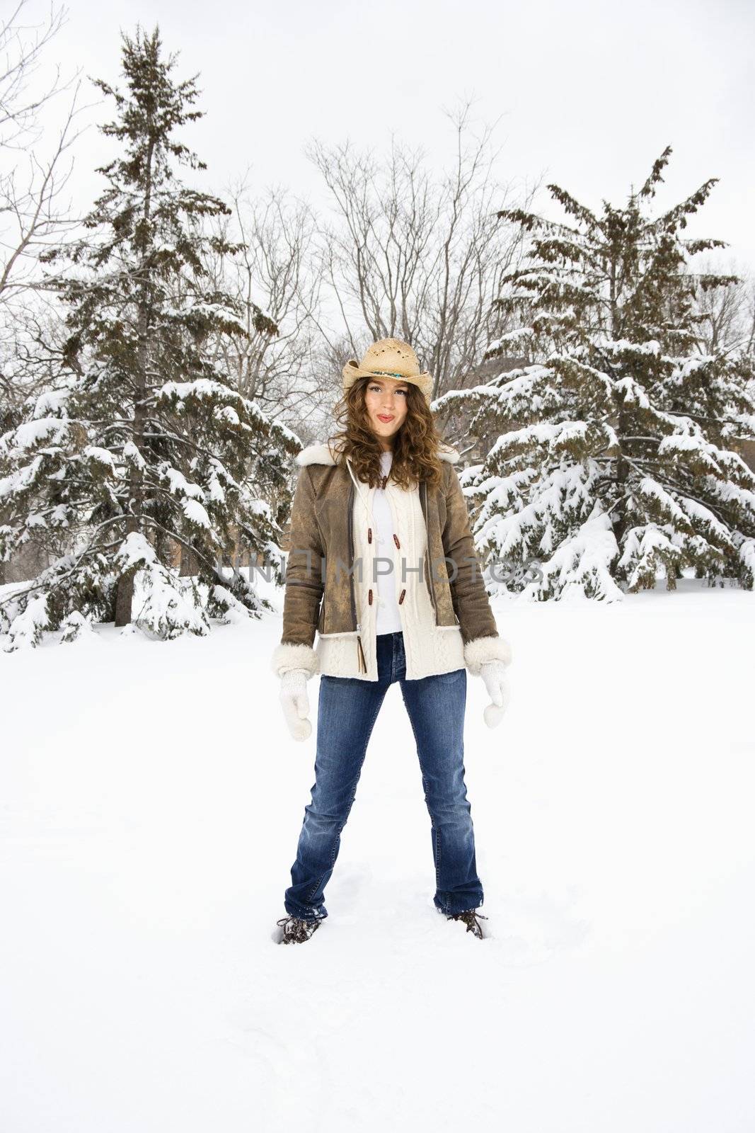 Pretty woman in snow. by iofoto