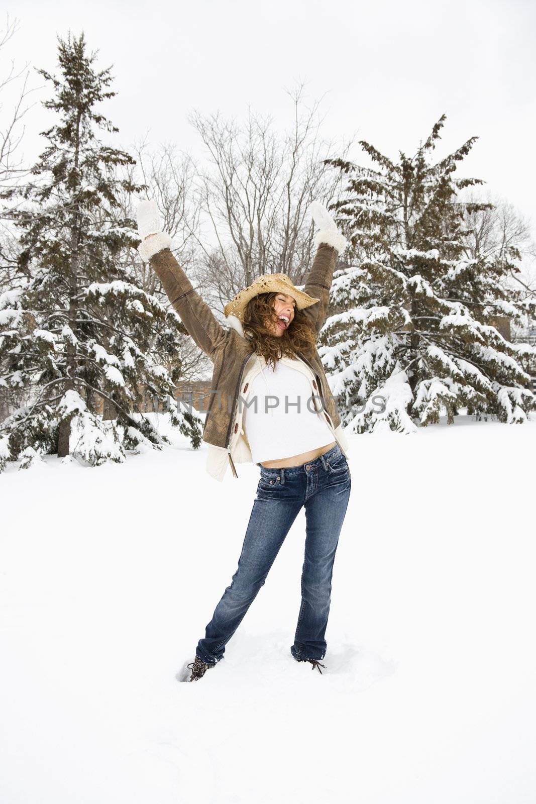 Woman posing in snow. by iofoto