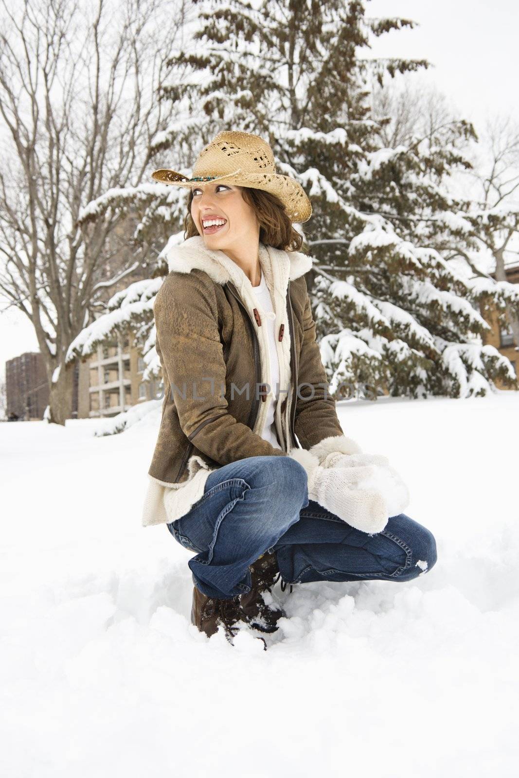 Woman with snowball. by iofoto