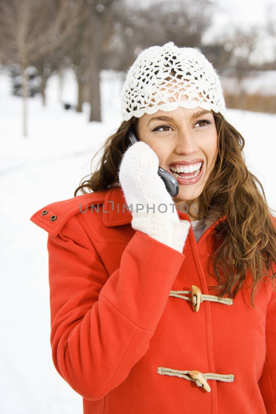 Pretty woman on phone. by iofoto