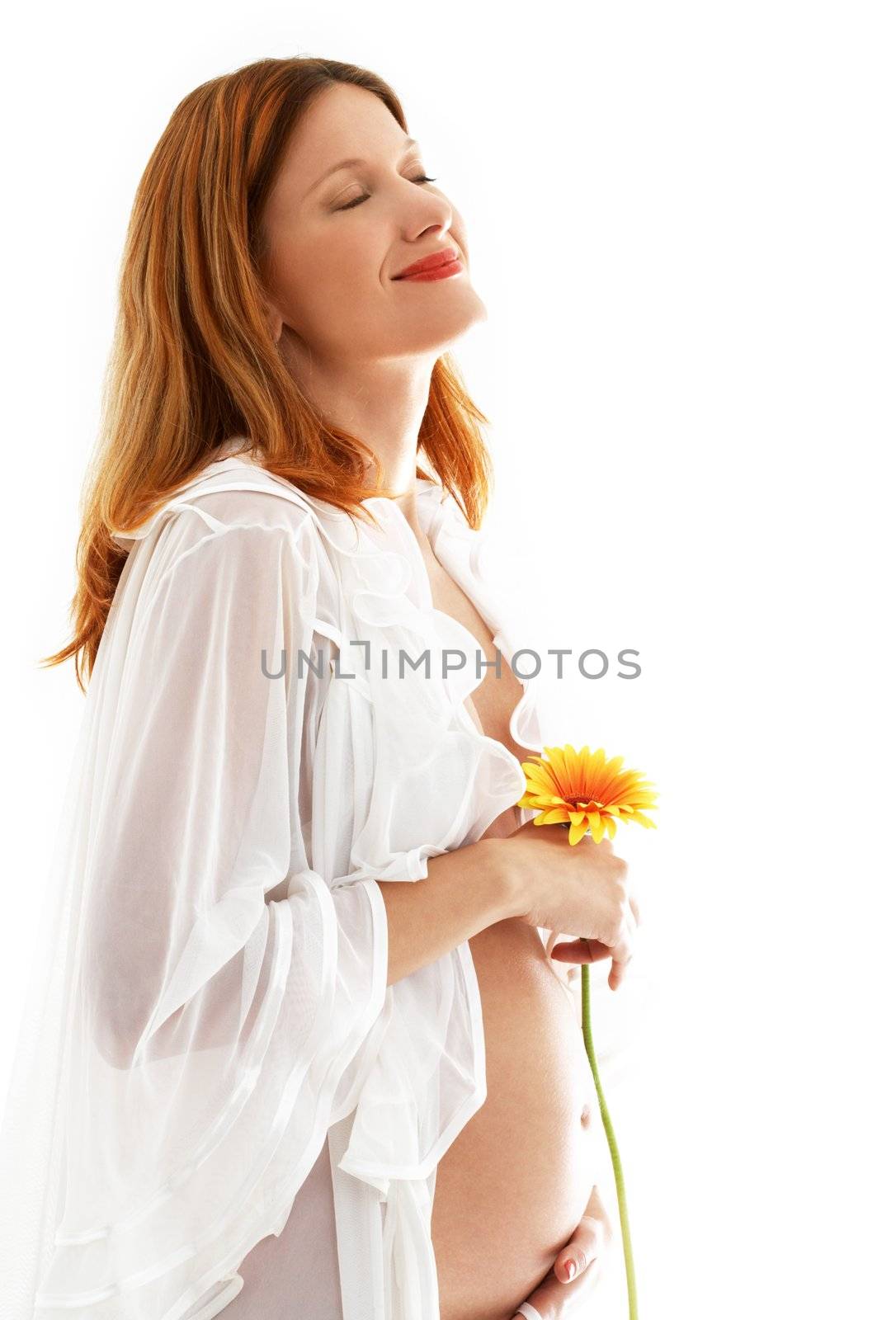 happy pregnant lady with flower over white background