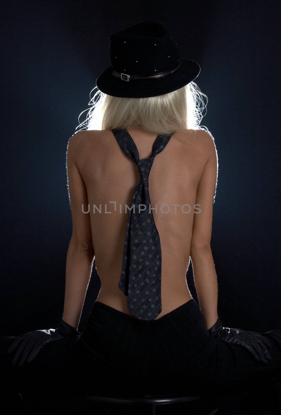 backlight image of cabaret girl with blue tie on her back