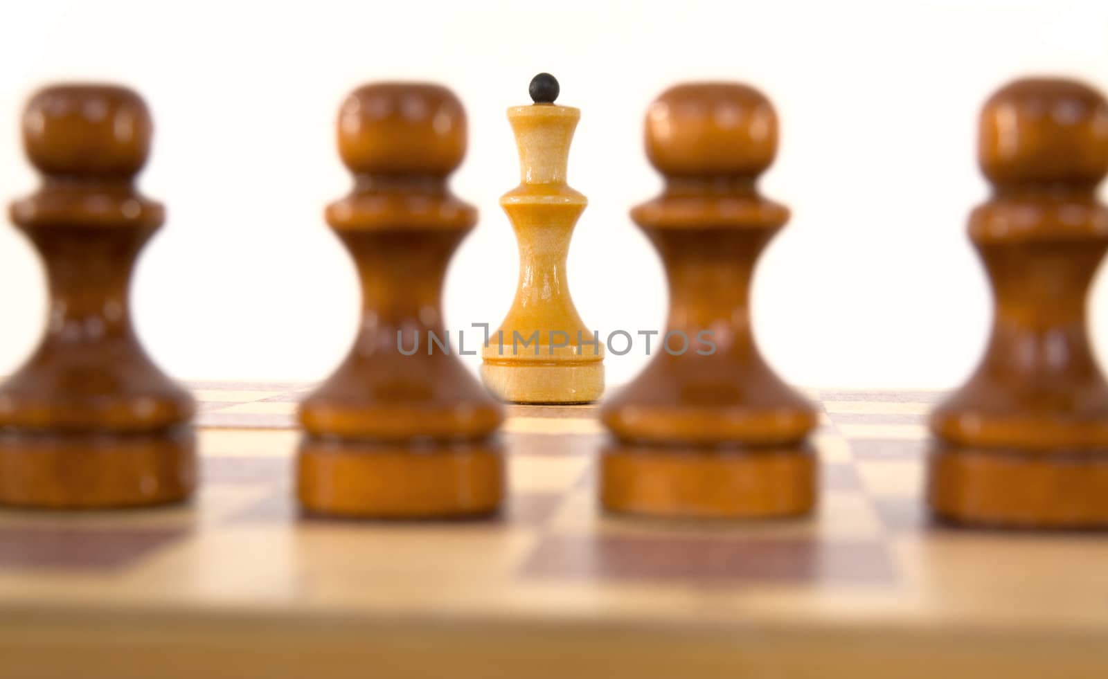 Chess queen and pawns on a white background