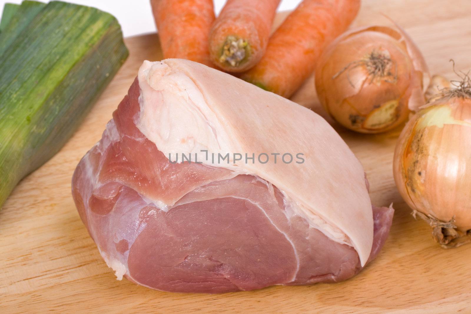 raw pork meat and sauce ingredients on a wooden plate