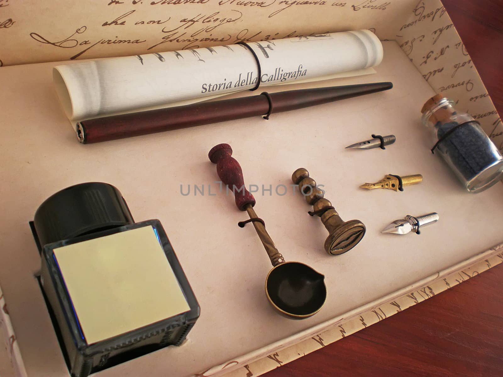 calligraphy ink pen set in a box on wooden table