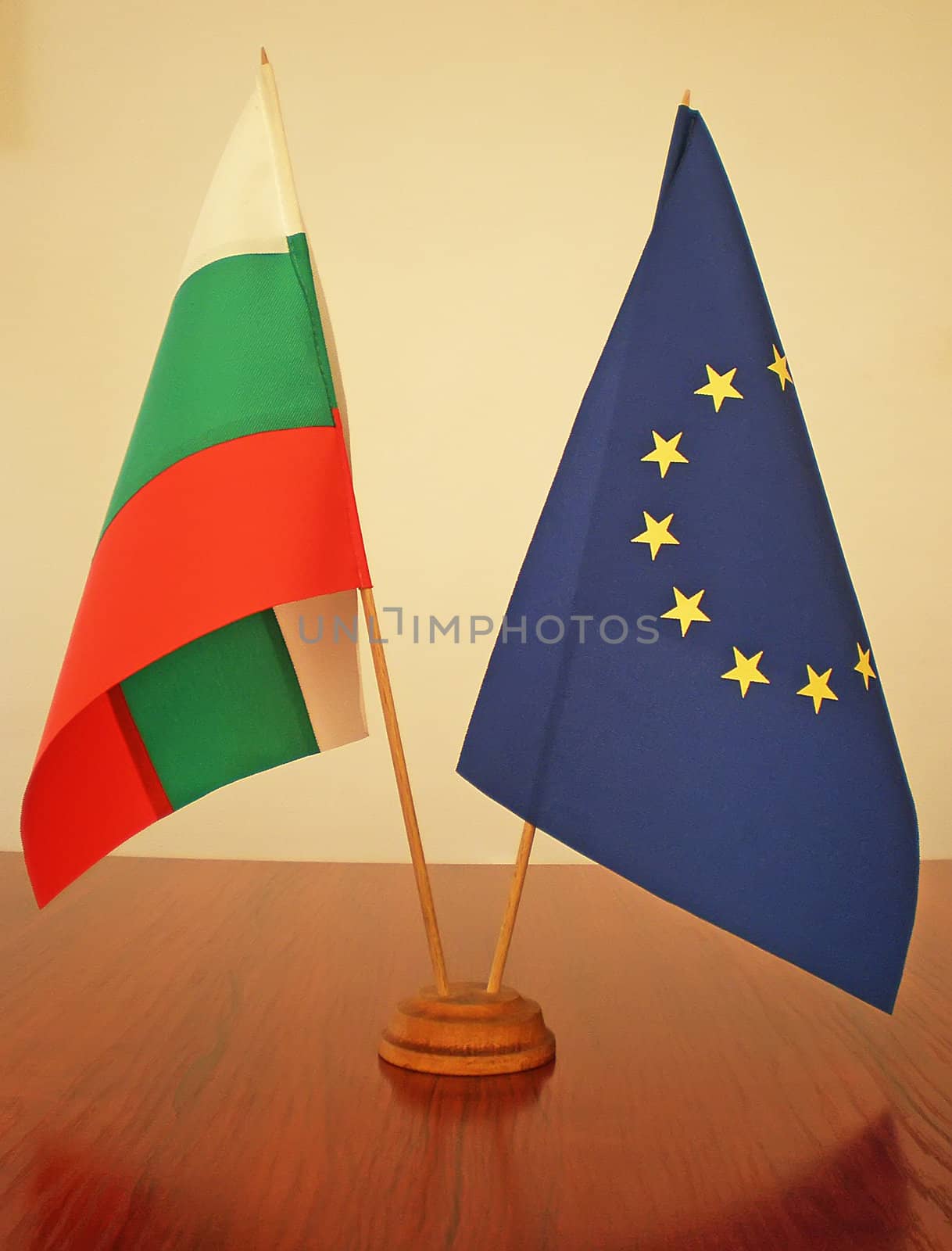 bulgarian and european flags on a wooden table     
