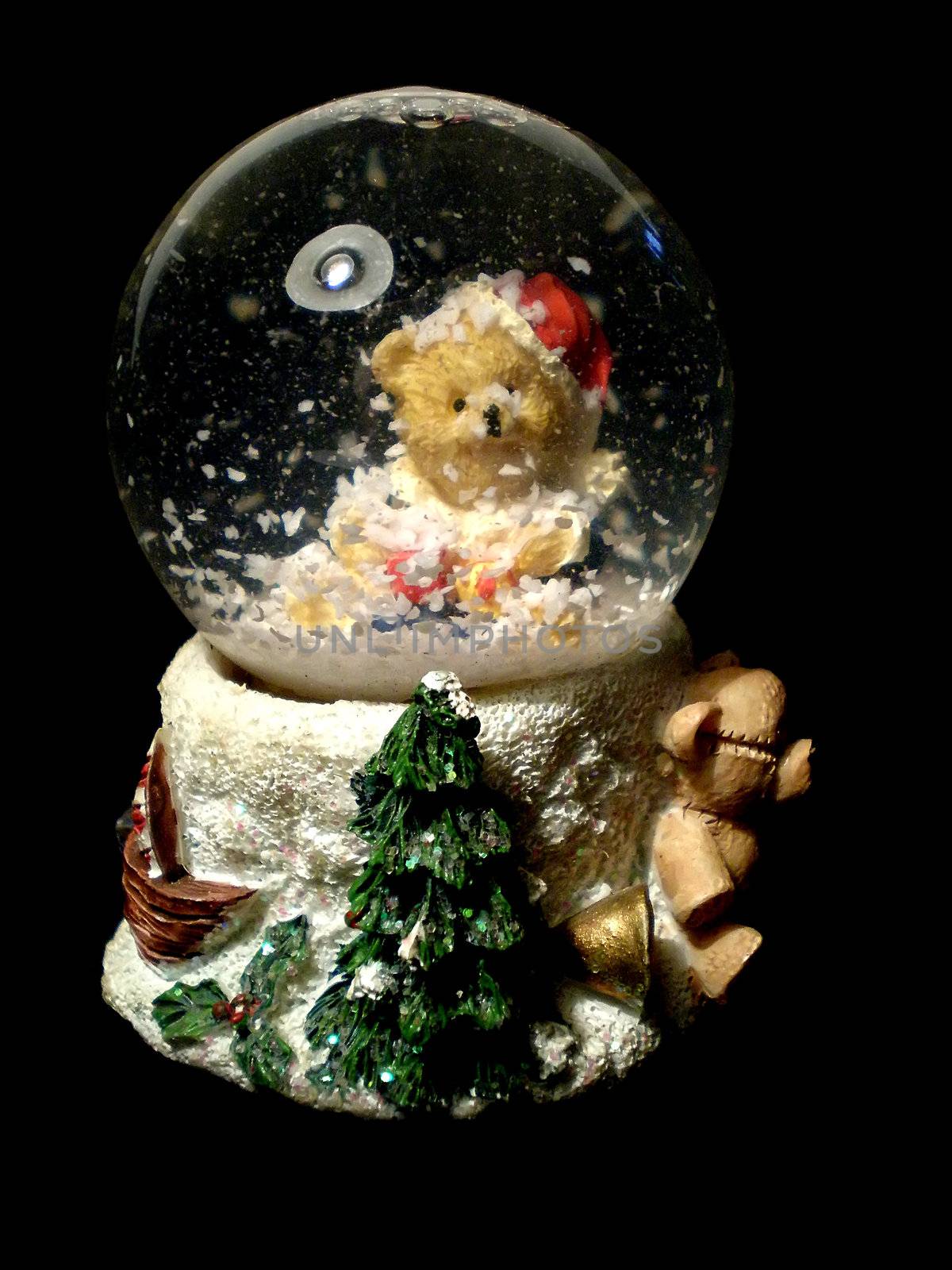 Christmas snow globe isolated on black background