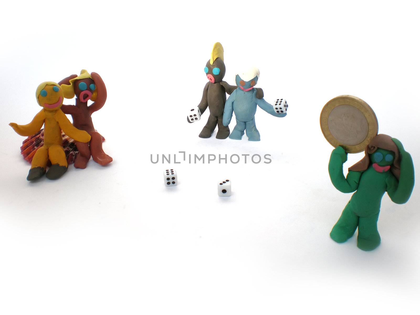 plasticine people figures playing with dice on white background