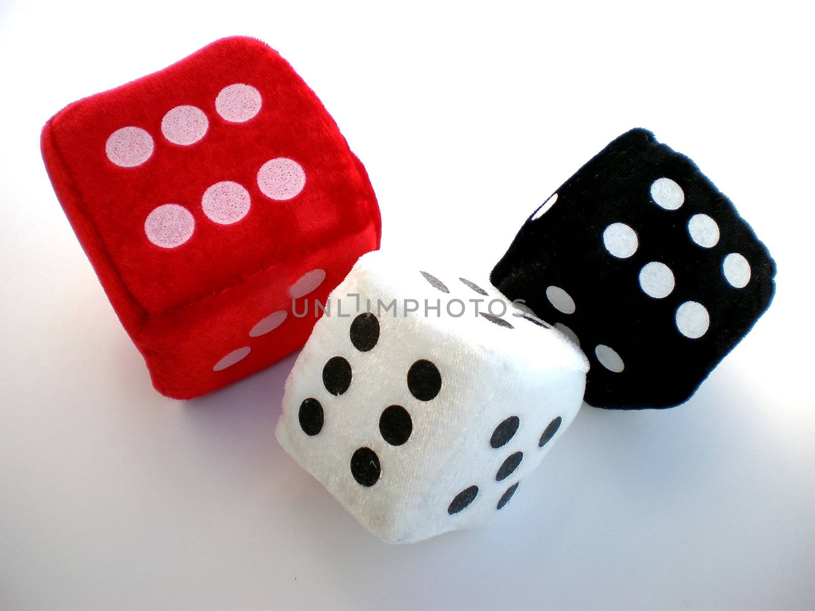 red, white and black dice isolated on white background