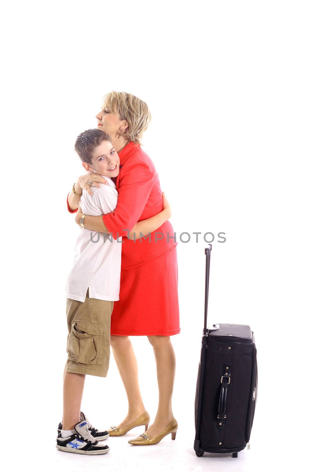 shot of a woman hugging boy leaving by creativestock