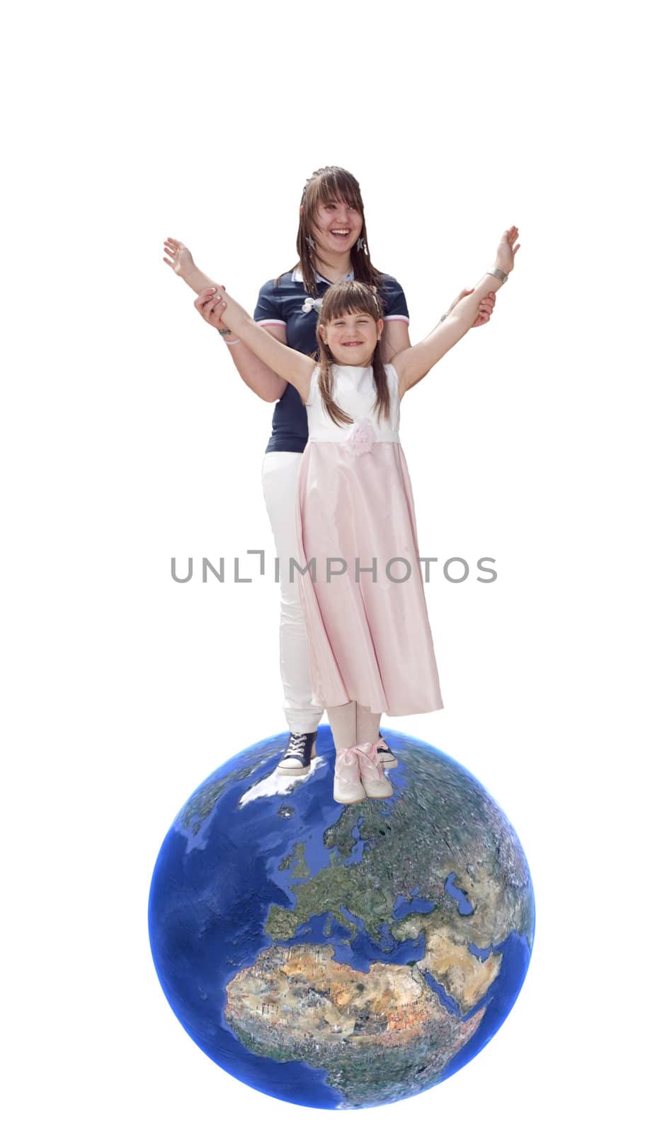 Two sisters laugh together over a globe