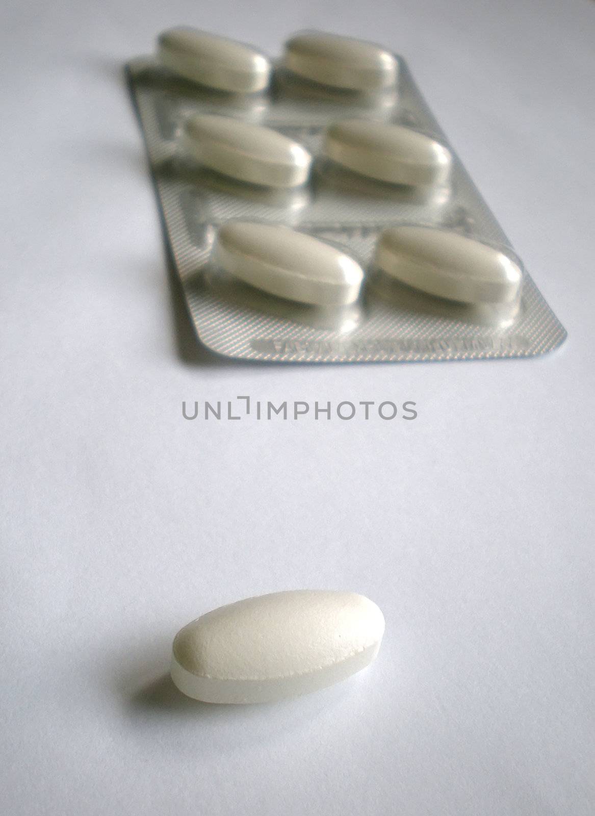 pile of pills isolated on white background