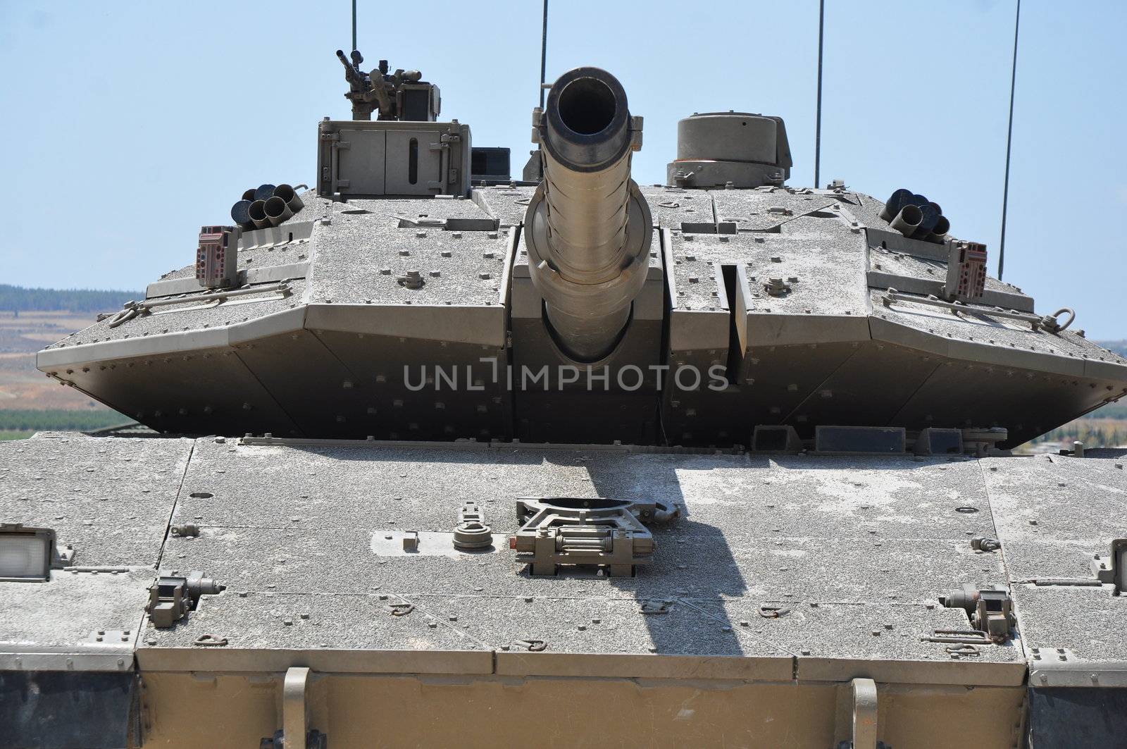 Old tank against the blue sky . Israel, Latrun.