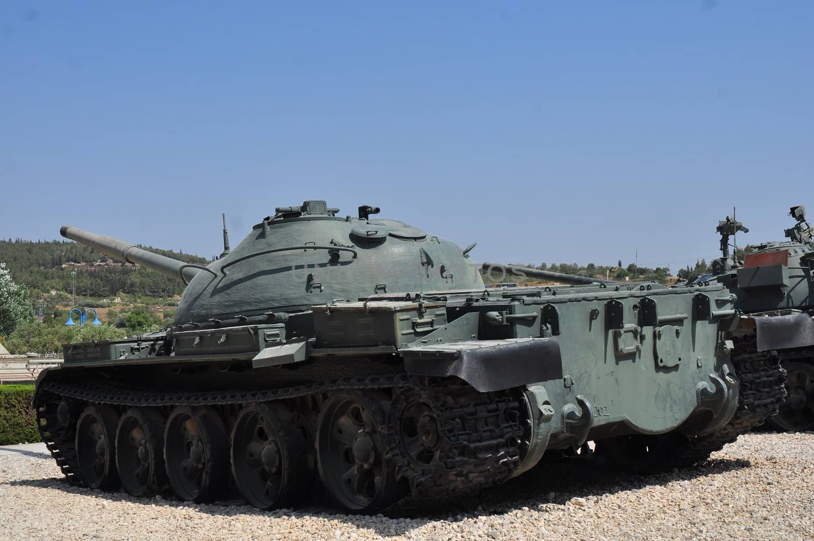 Old tank against the blue sky . Israel, Latrun.