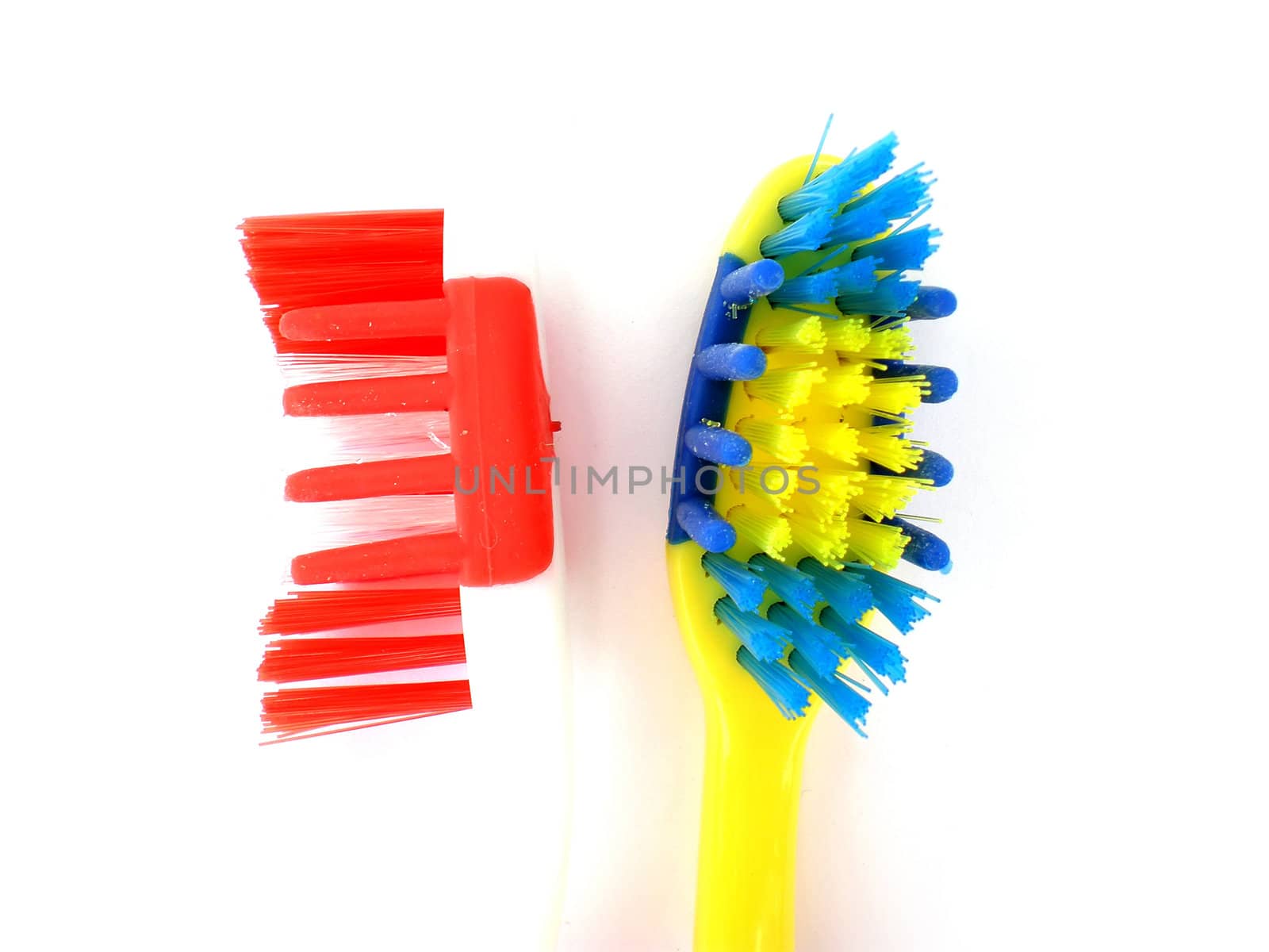 red and blue toothbrush isolated on white background