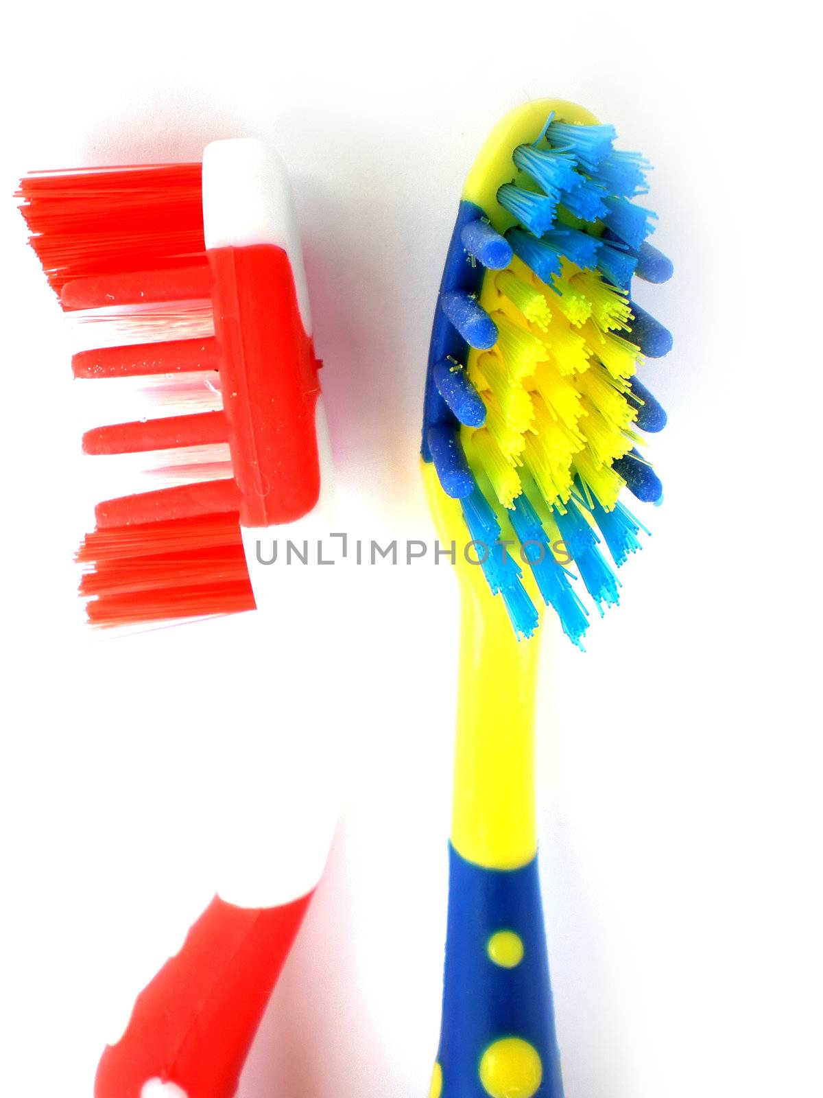 red and blue toothbrush isolated on white background