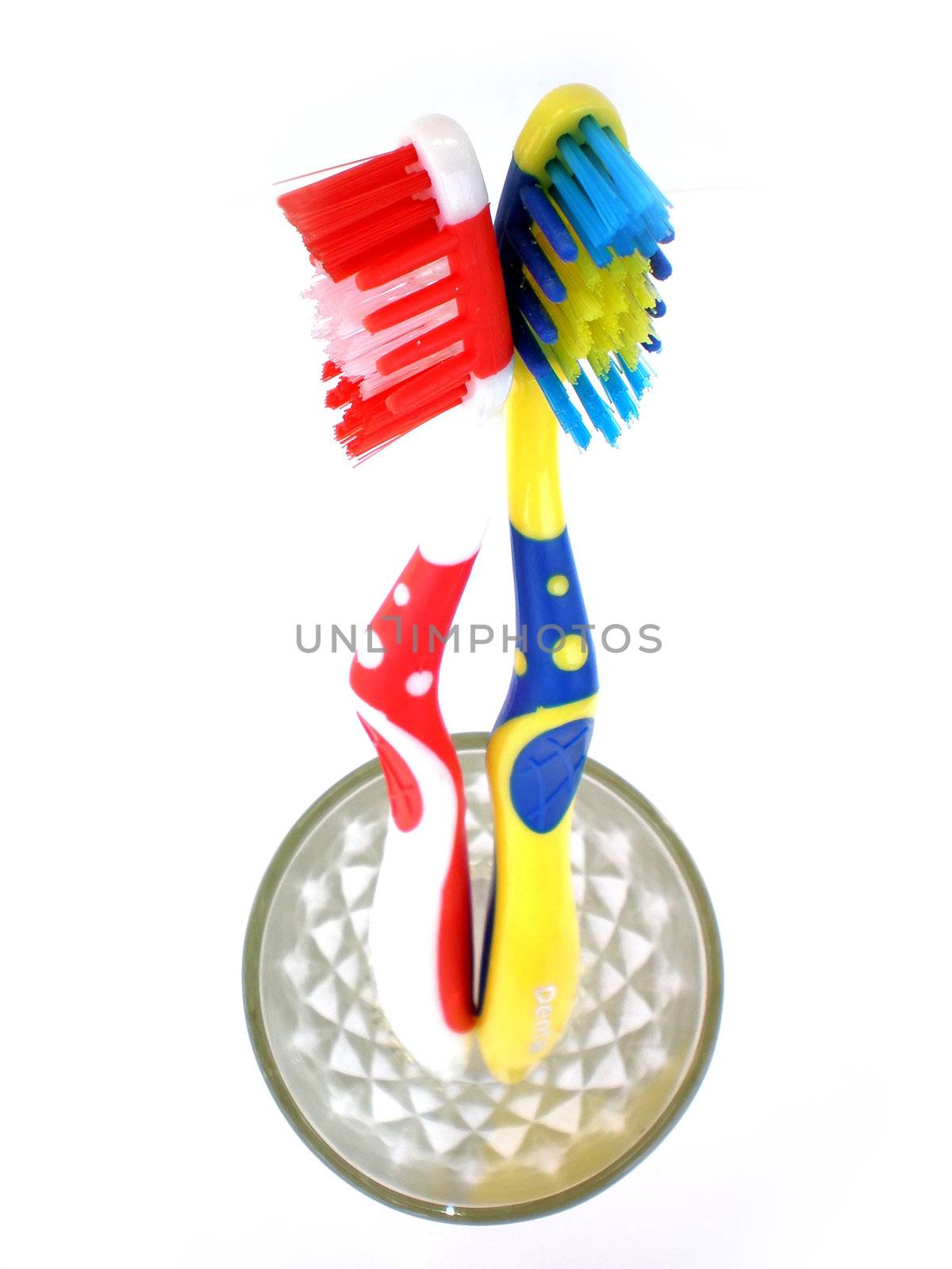 red and blue toothbrush isolated on white background