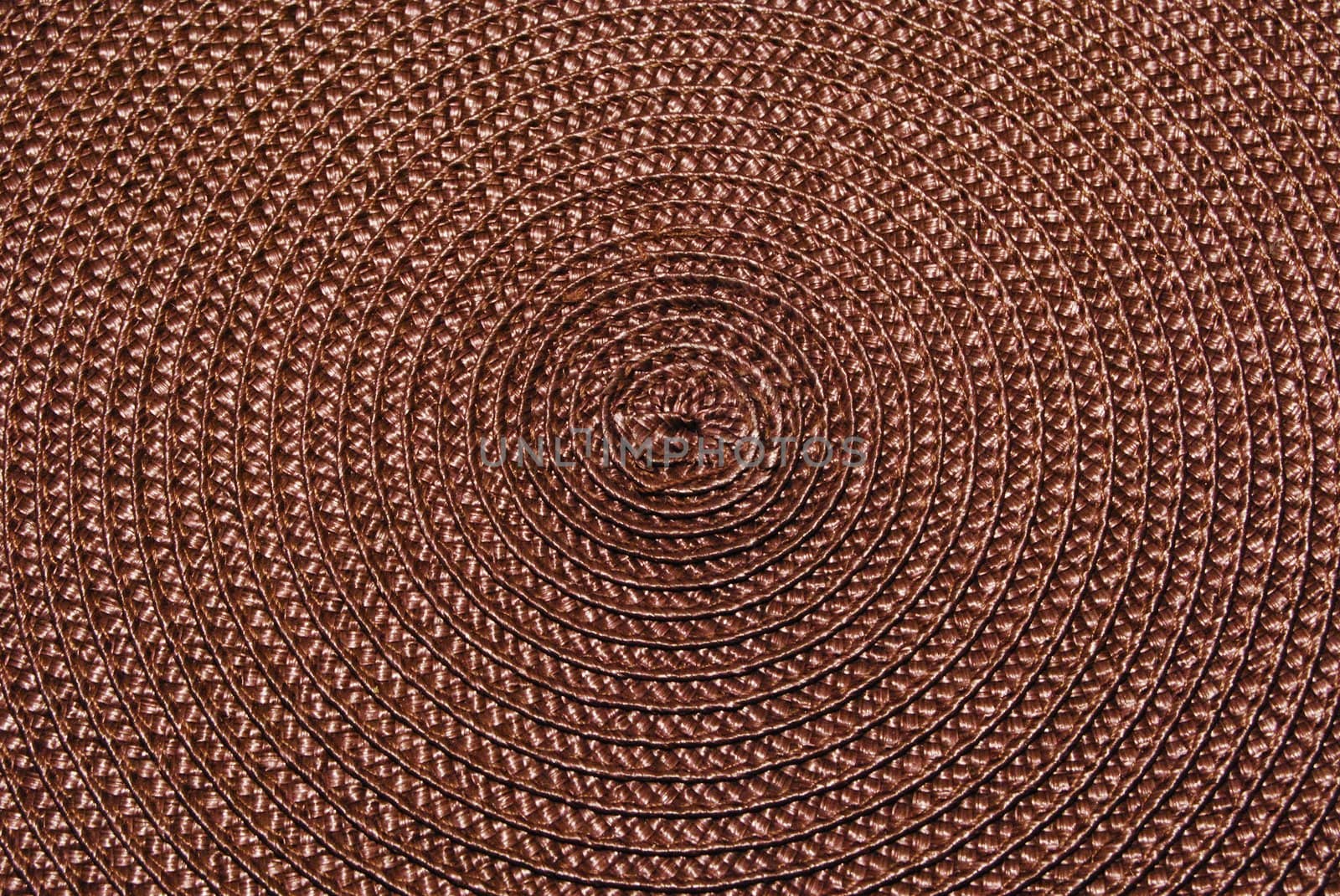 Texture of round wicker paper table napkin.