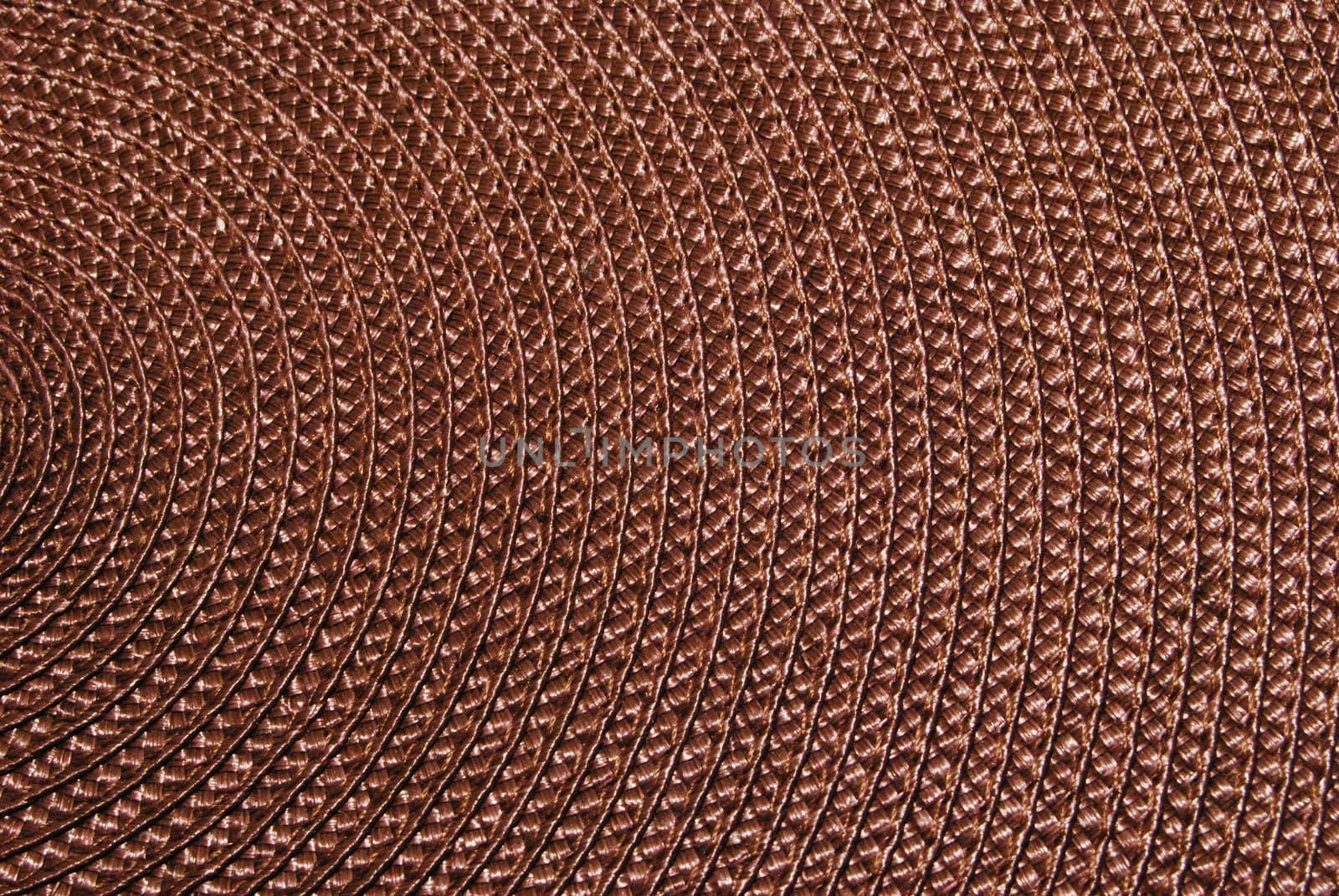 Texture of round wicker paper table napkin.