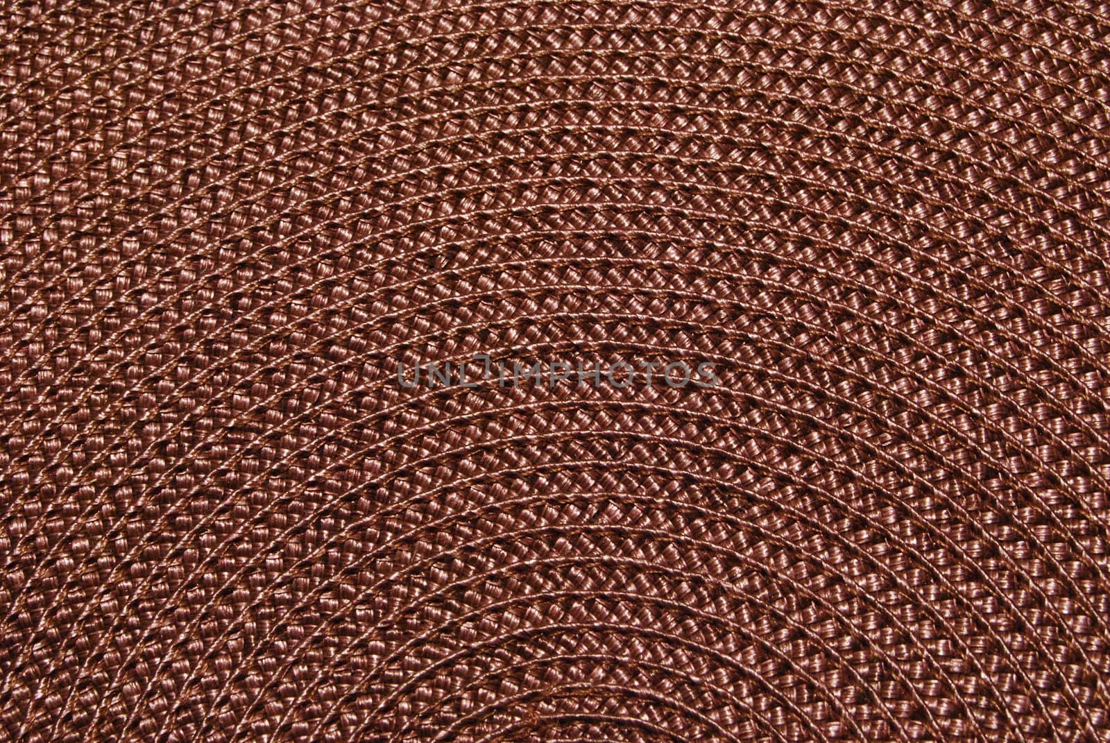 Texture of round wicker paper table napkin.