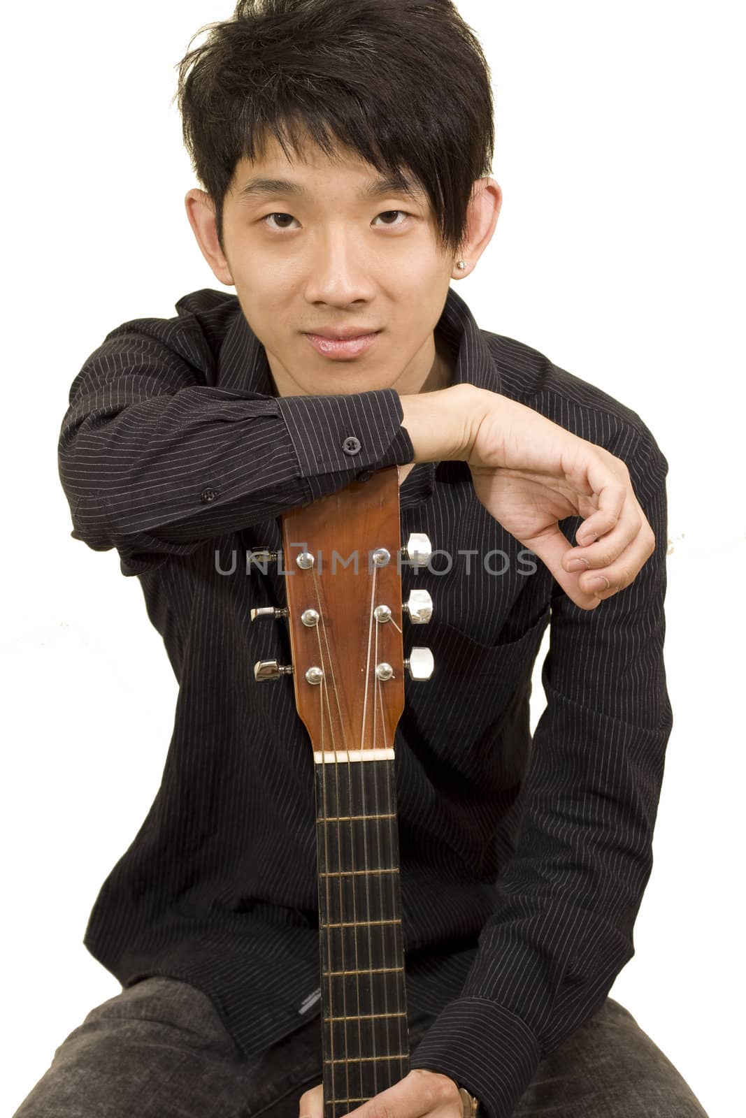 asia boy plays his guitar 