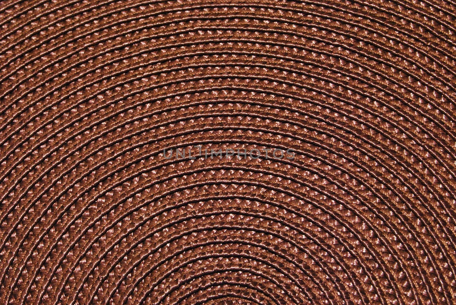 Texture of round wicker paper table napkin.