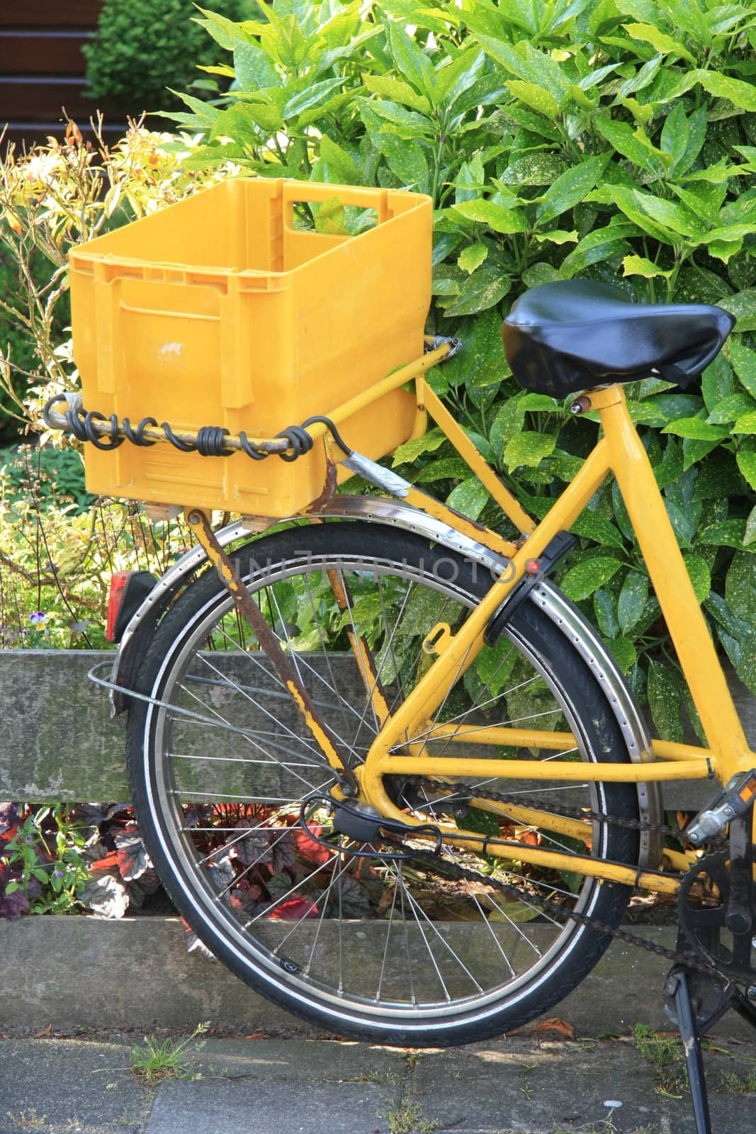 Yellow transportation bike by studioportosabbia