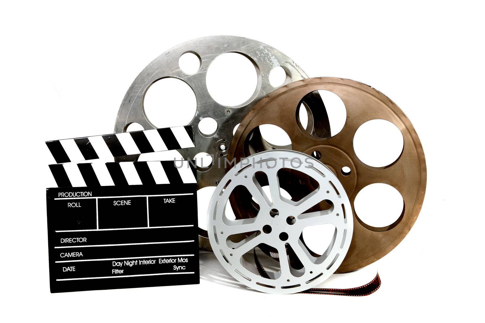 Film Canisters With Directors Clapboard on White Background