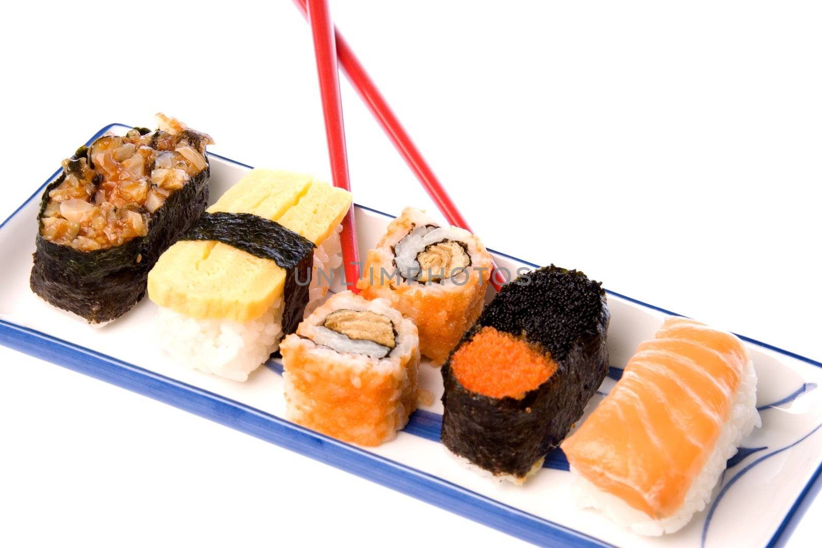 Isolated image of sushi with chopsticks.