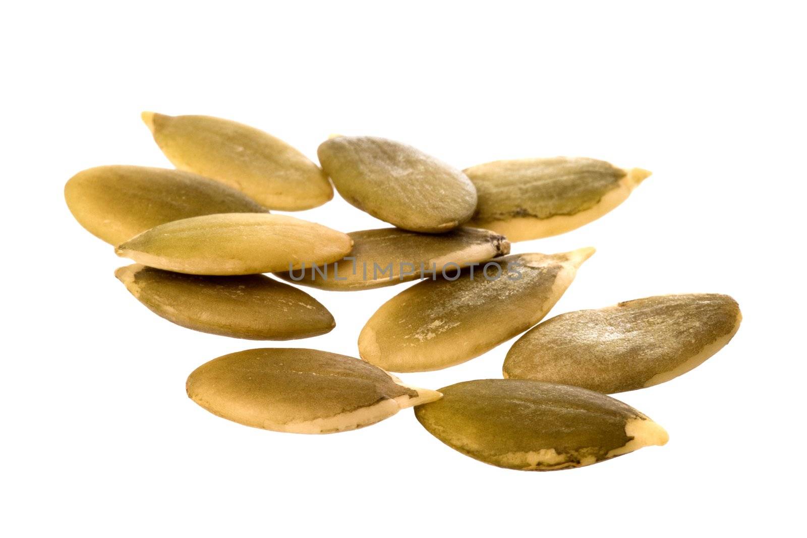 Isolated macro image of pumpkin seeds.