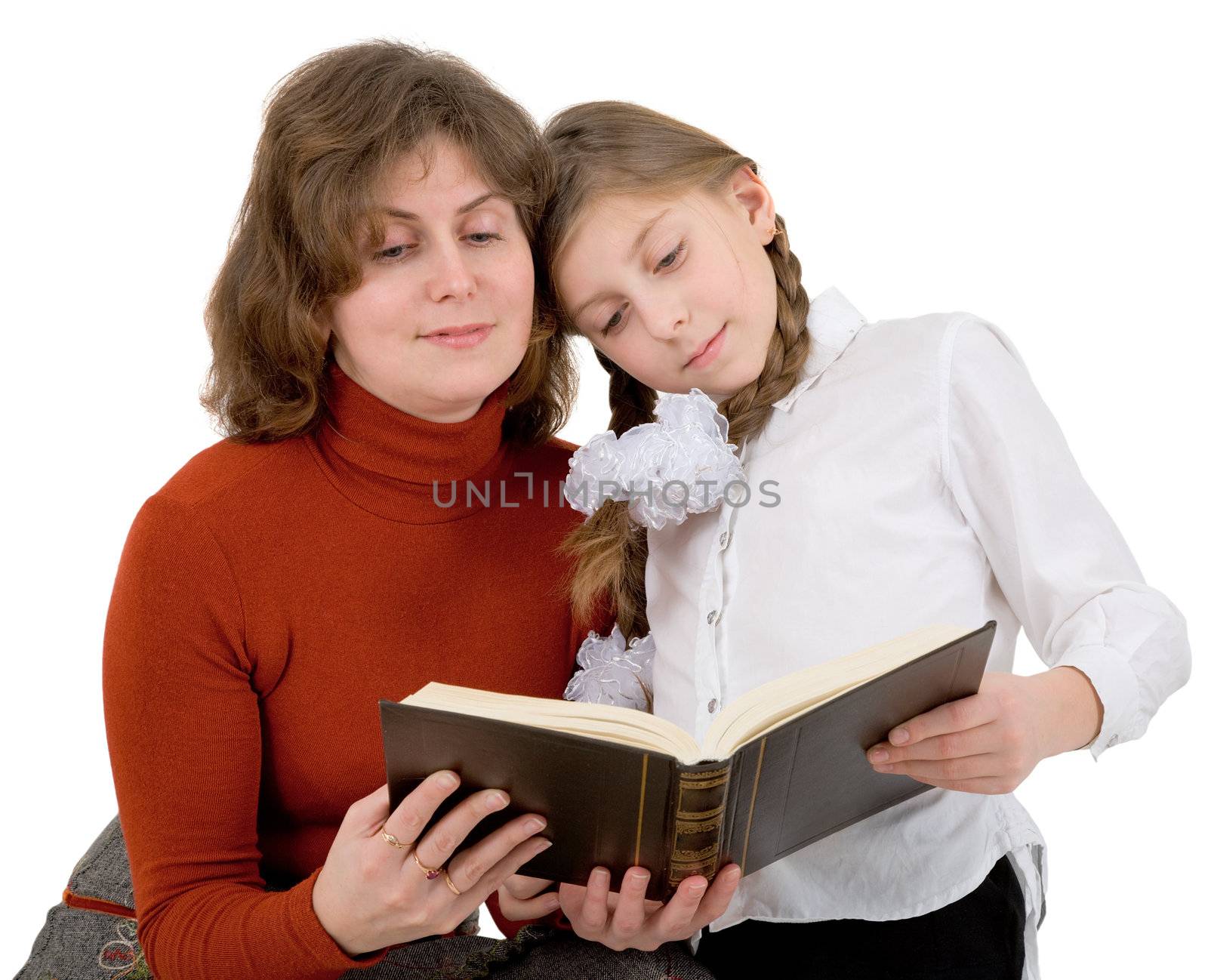 Woman with girl reading book on white 