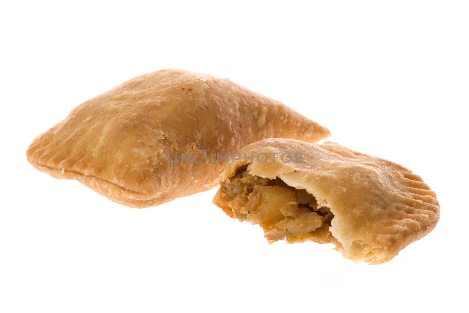 Isolated macro image of curry puffs.