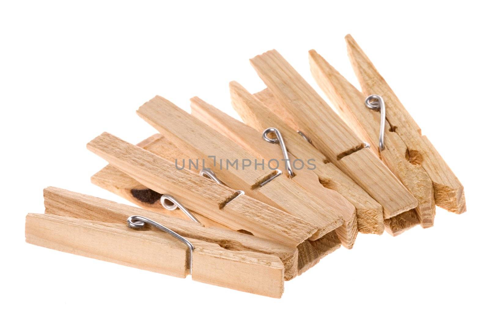 Isolated macro image of wooden laundry pegs.