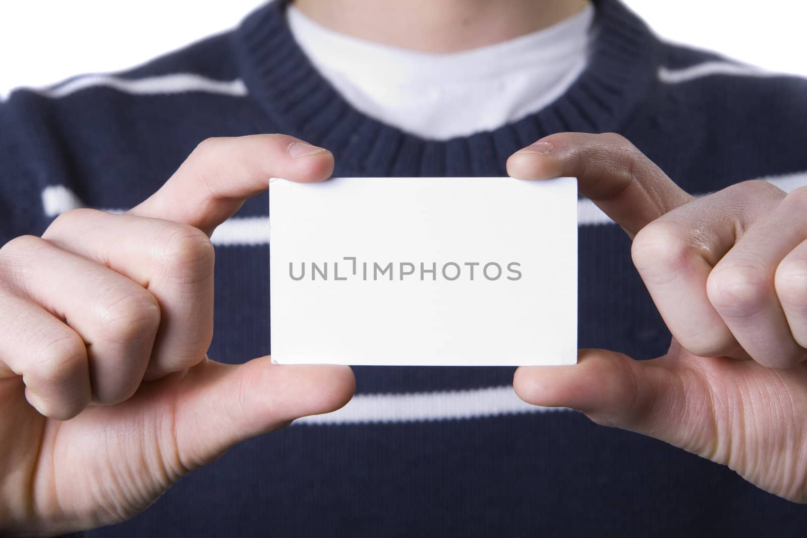 fingers holding a blank business card