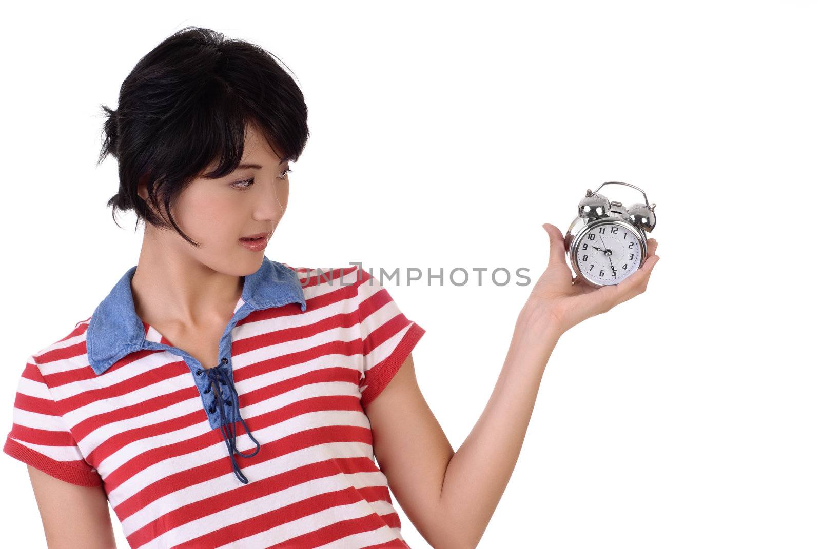 Woman with alarm clock, closeup portrait on white background.