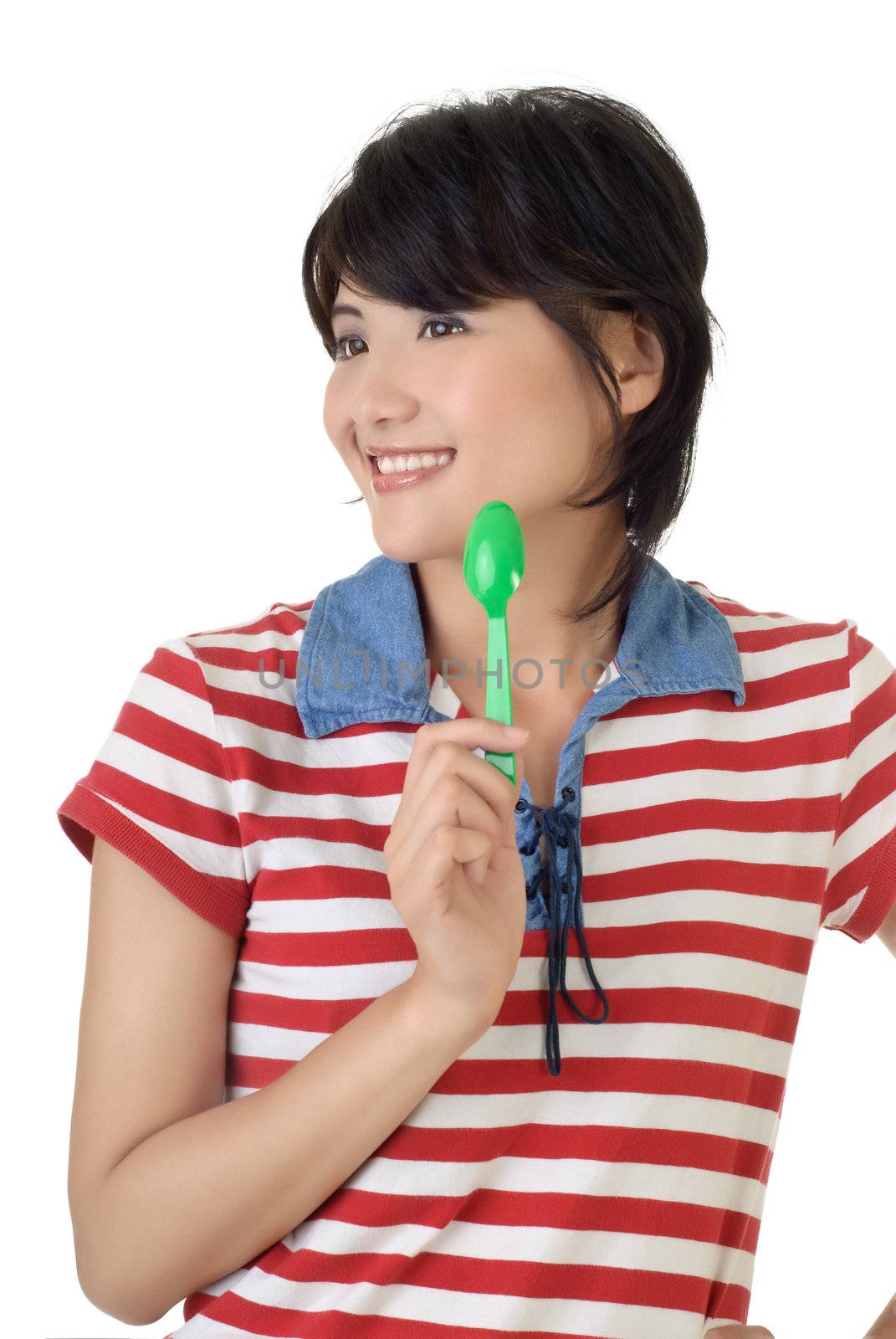 Happy time of eat, closeup portrait of woman holding tablespoon and smiling.