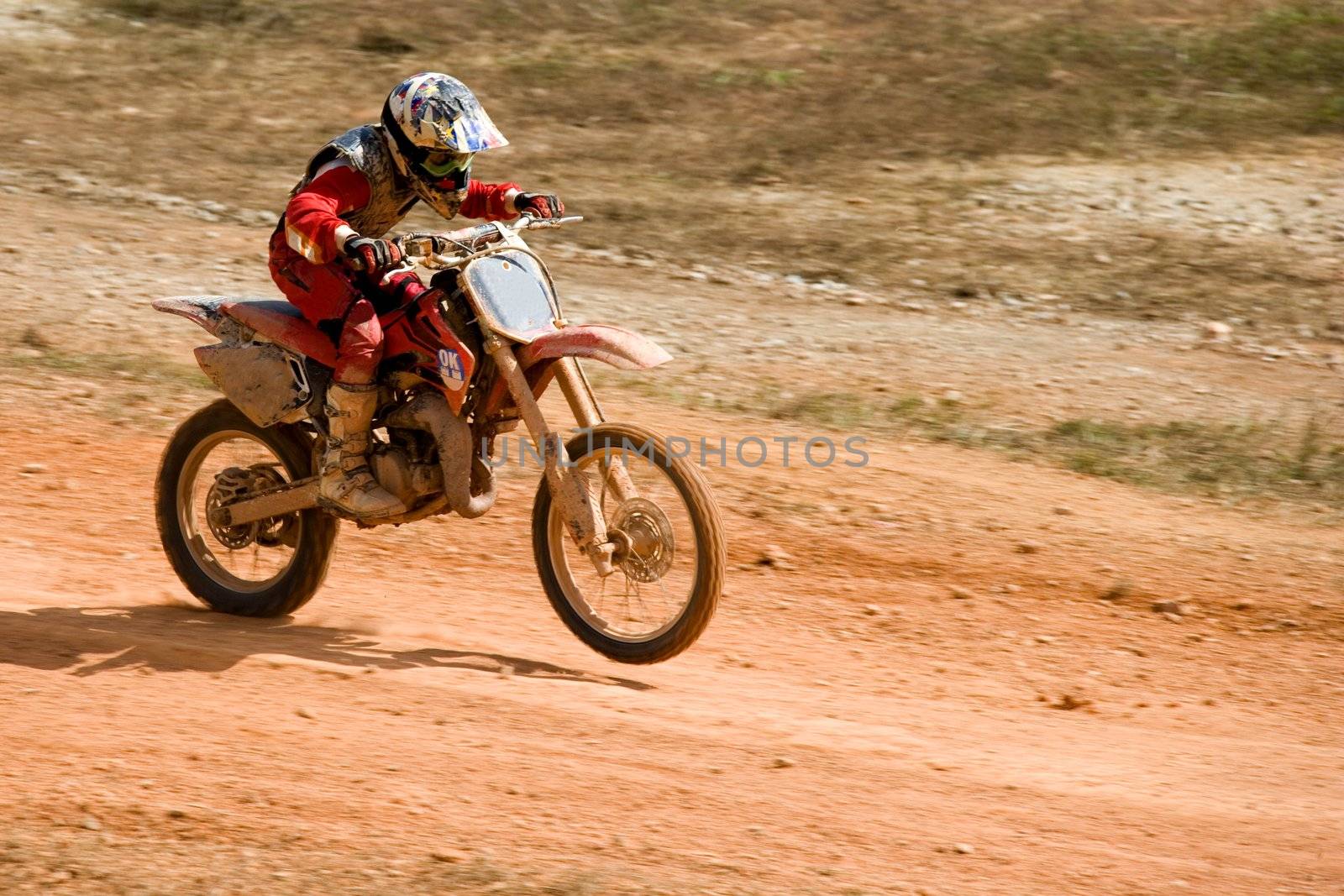 Image of a motocross participant in action.