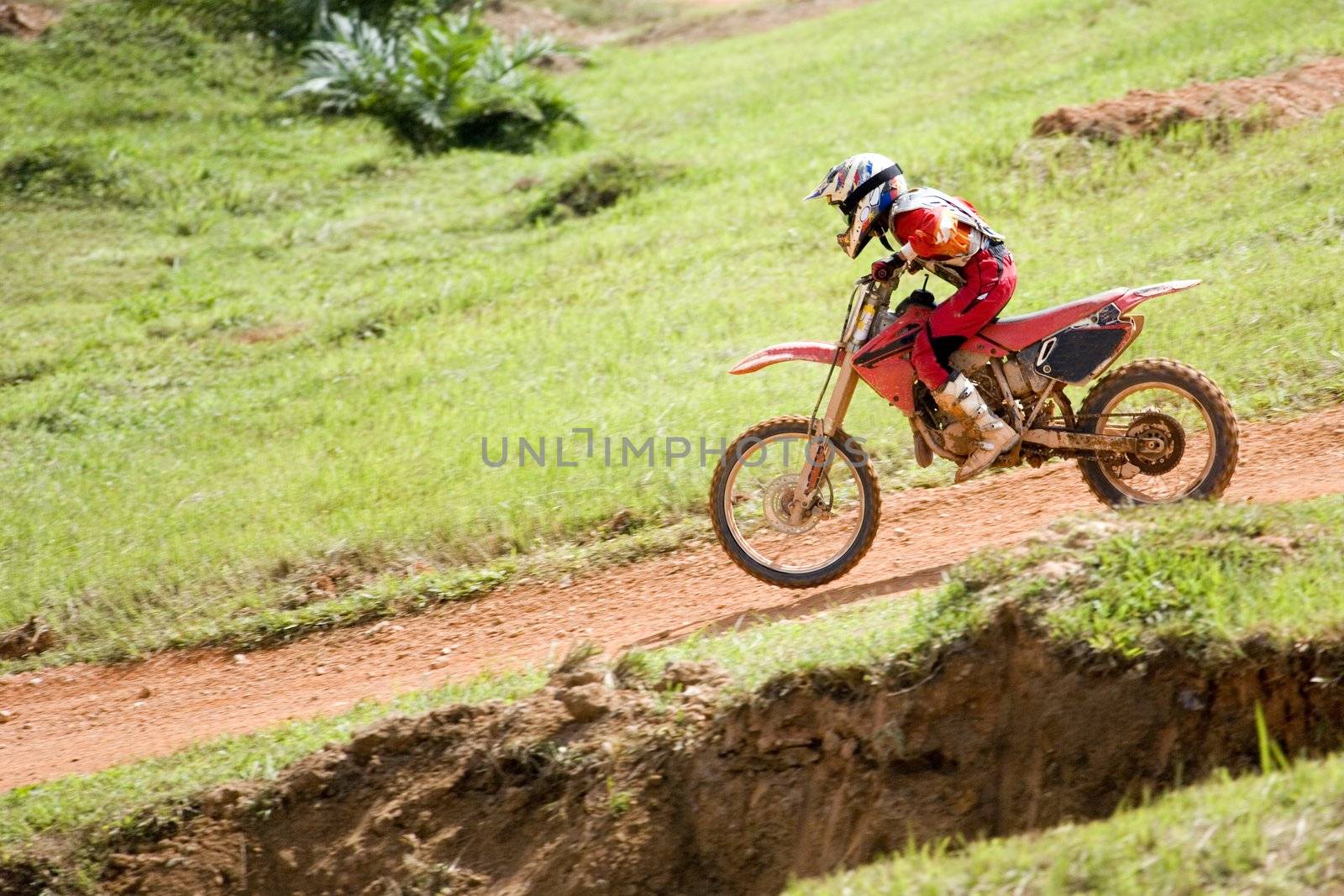 Image of a motocross participant in action.