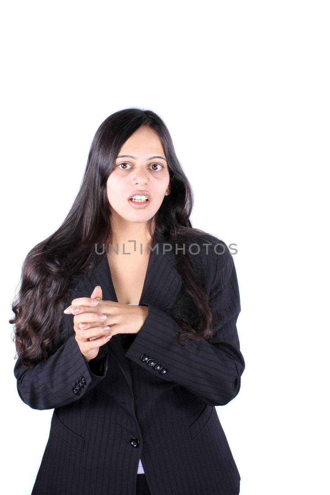 A portrait of a beautiful Indian business manager in a formal suit, on white studio background.
