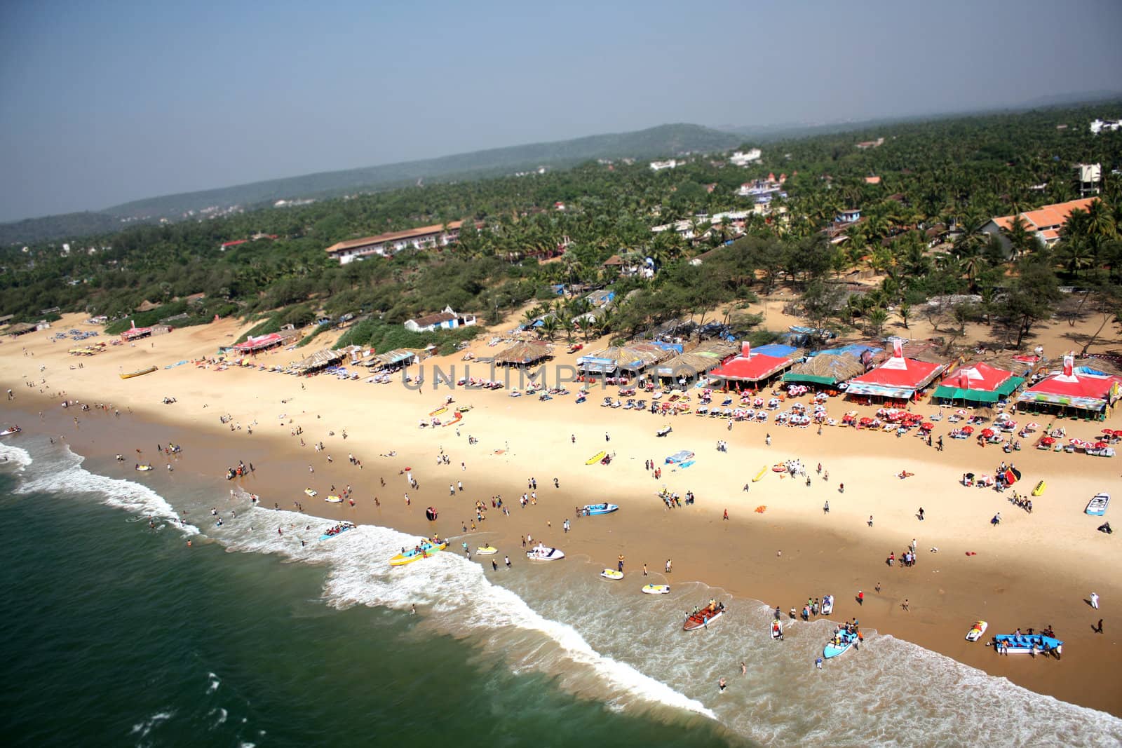 An aerial view of a crowded beach in Goa, India.