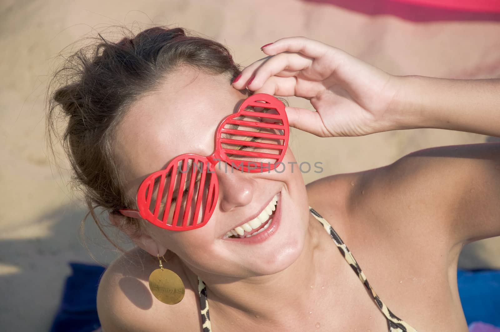 Girl smiling in red sunglasses - hearts. by Oledjio