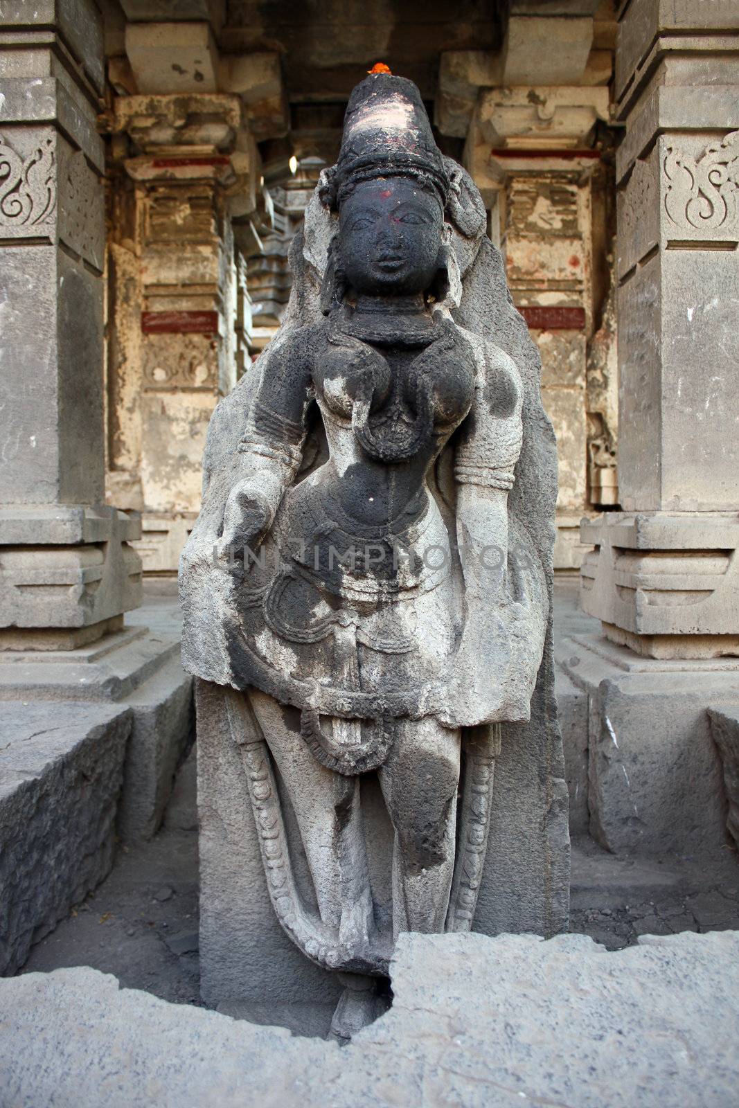 A very ancient sculpture of lord Vishnu in the temple ruins of Kudalsangam in India.