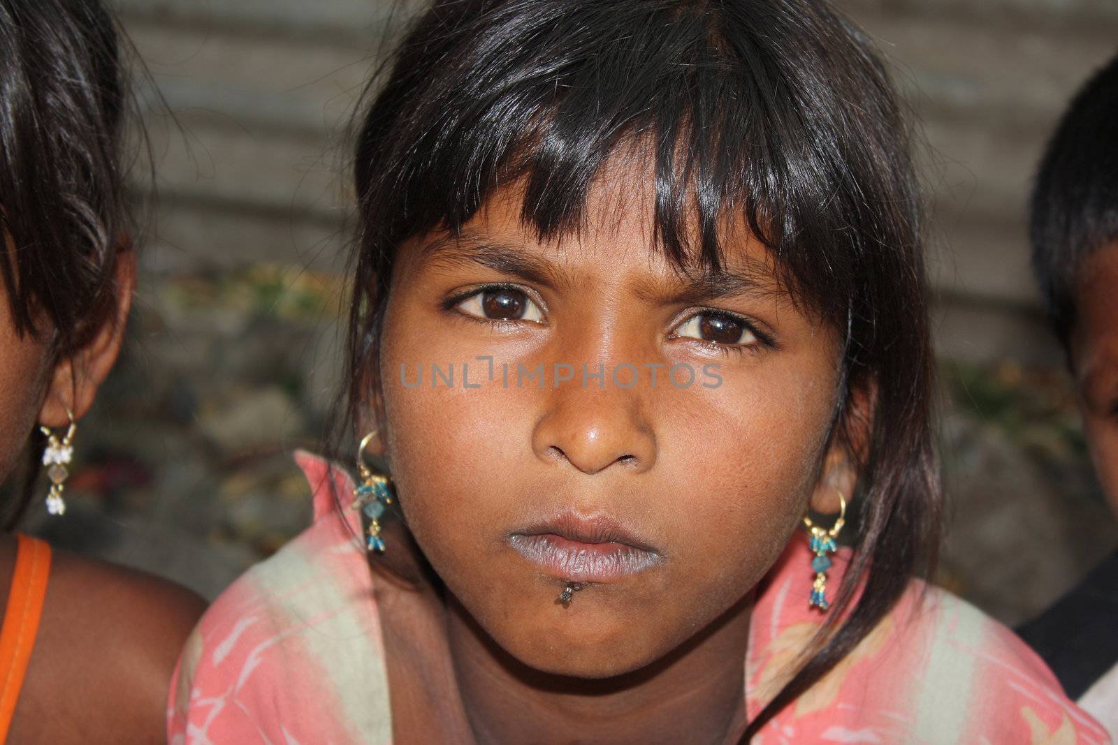 A portrait of a poor Indian beggar girl.